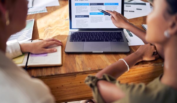 Laptop, website page and people meeting for digital marketing, planning strategy and summary of com.